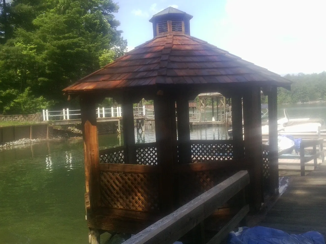 Cedar shake gazebo roof rebuilt on a lake dock in Center Barnstead